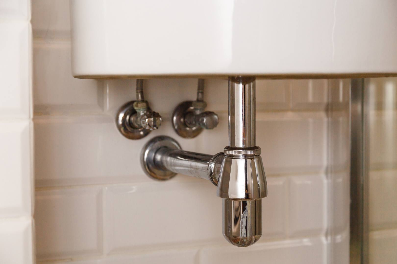 Basin siphon or sink drain in a bathroom, clean